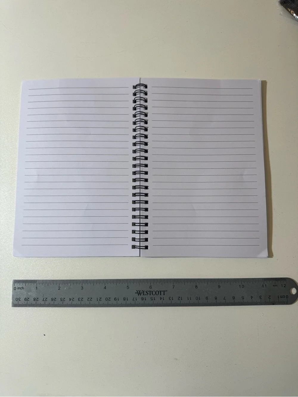 Black Spiral Notebook with White Text 